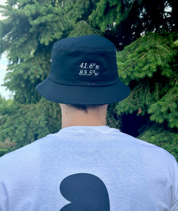 black bucket hat with embroidered coordinates, back